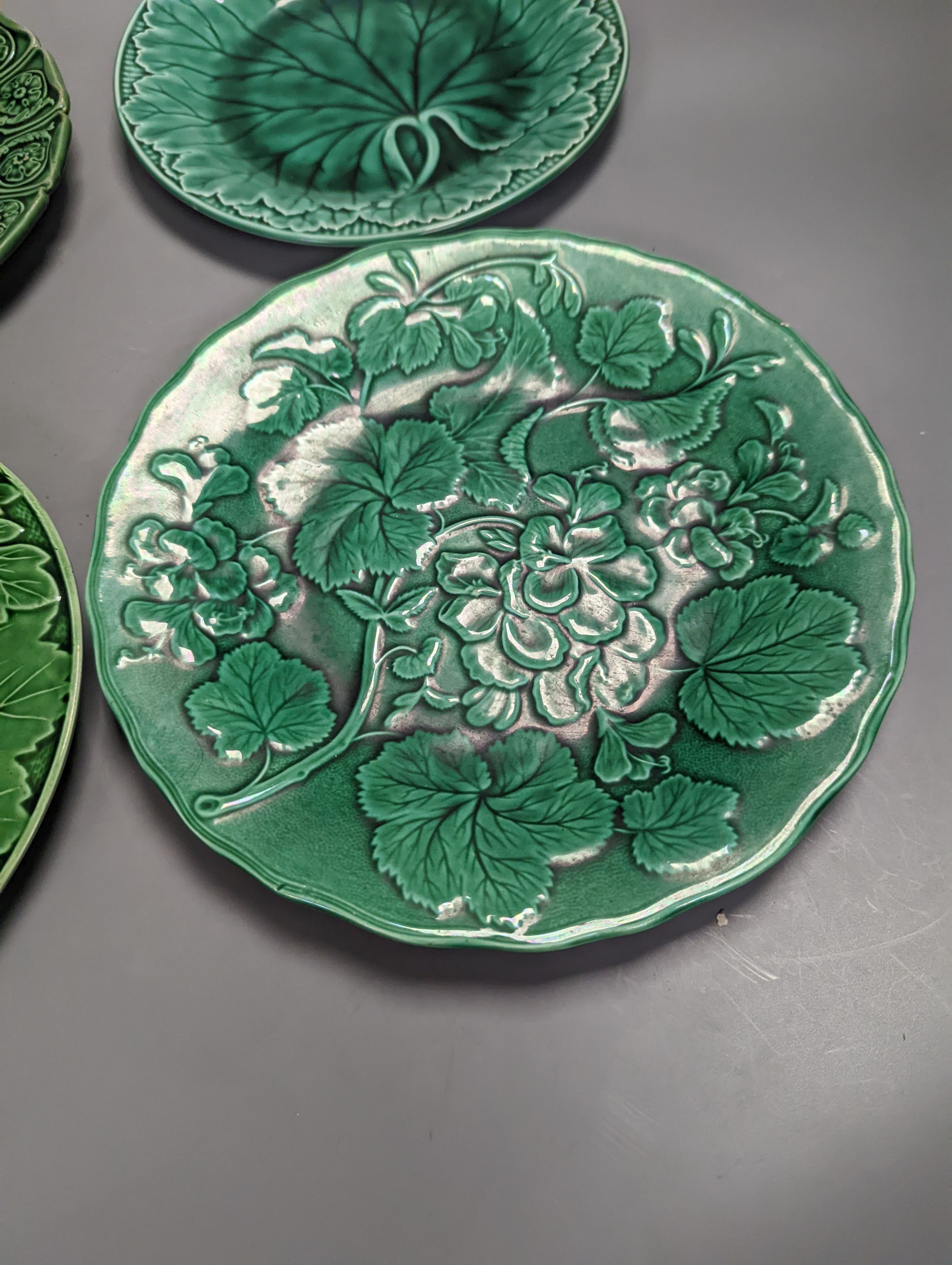 Twelve Victorian and later green glazed leaf dishes, largest 25.5cm